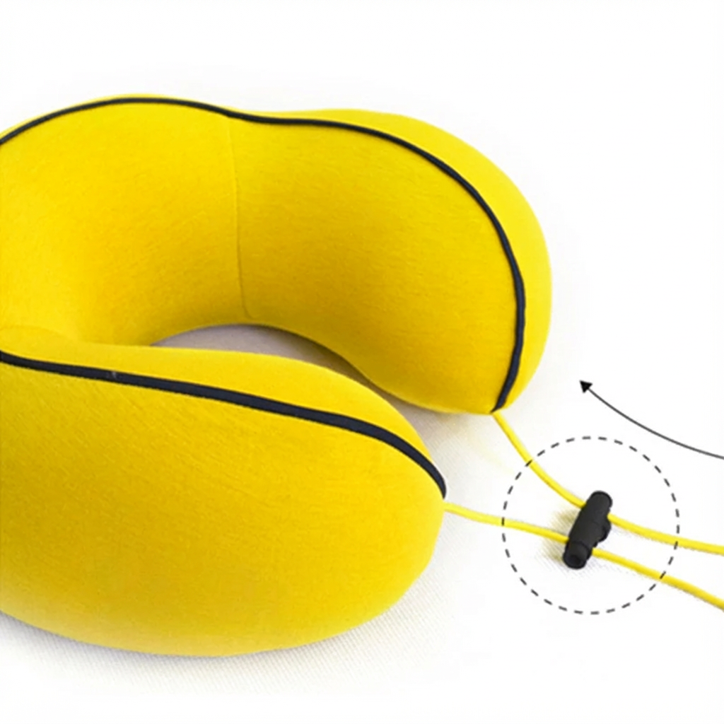 Yellow neck pillow with a black strap on a white background